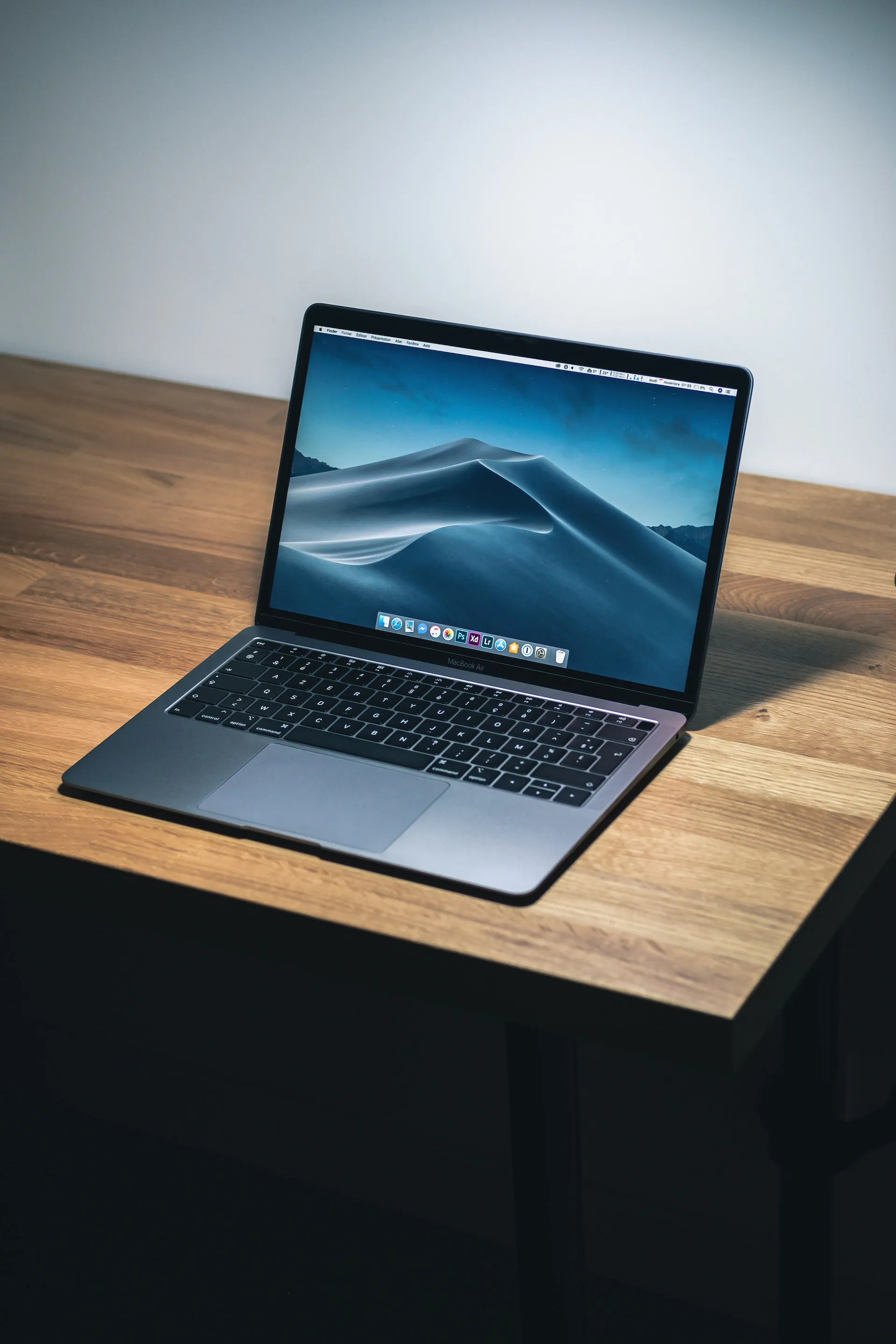 A laptop on a wooden desk